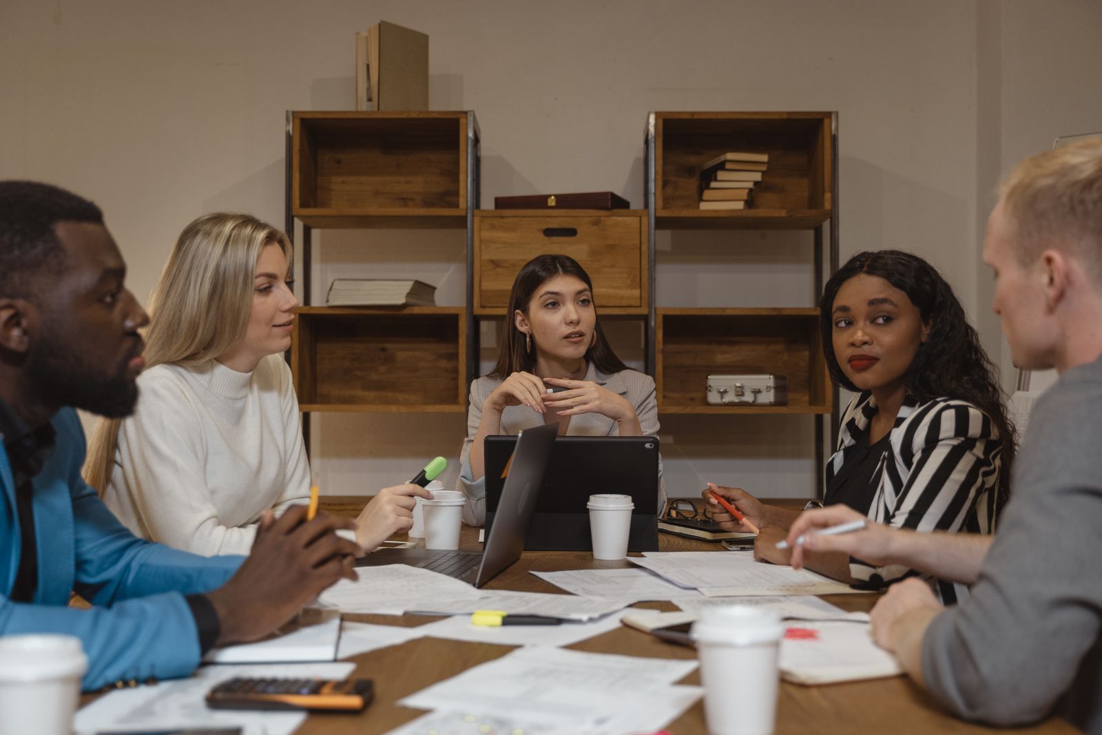 CoC leaders in discussion around a meeting table